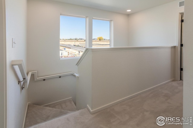 stairway featuring visible vents, recessed lighting, baseboards, and carpet floors