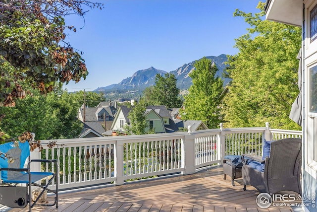 wooden terrace with a residential view and a mountain view
