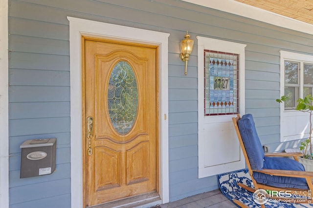 entrance to property with covered porch
