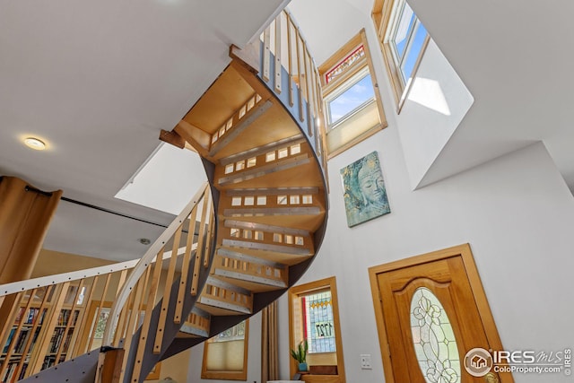 staircase with a high ceiling