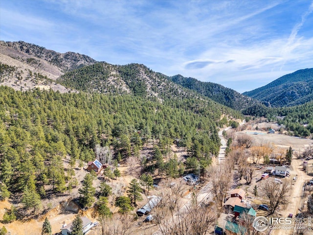 property view of mountains featuring a view of trees