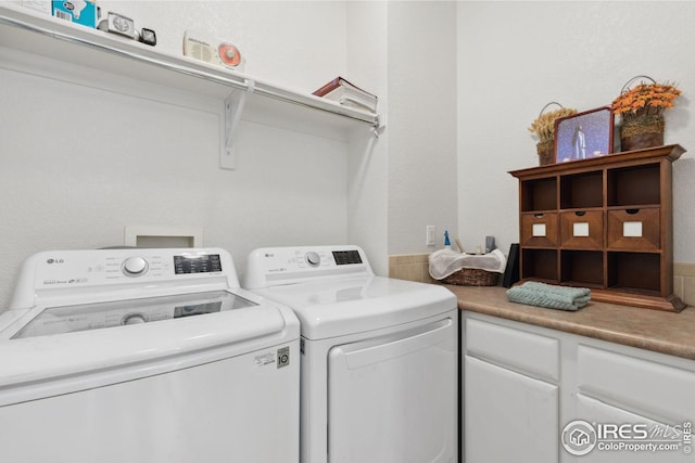 laundry area with independent washer and dryer