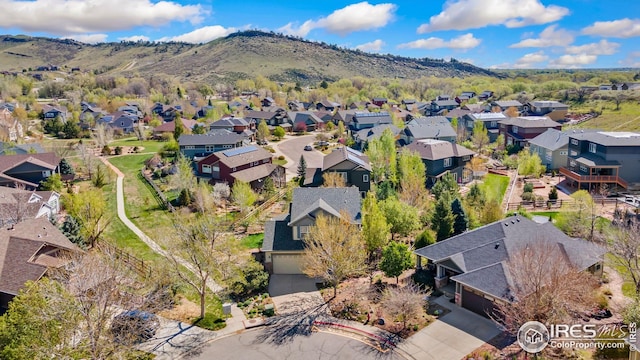 107 Bohn Ct, Lyons, CO 80540 - aerial view of property and surrounding area featuring nearby suburban area and a mountain backdrop