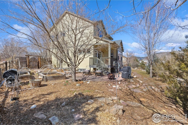 view of side of property featuring a garden