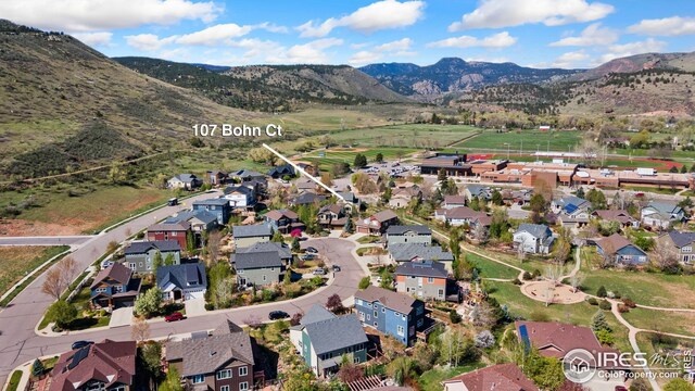 107 Bohn Ct, Lyons, CO 80540 - aerial view of property's location with mountains and nearby suburban area