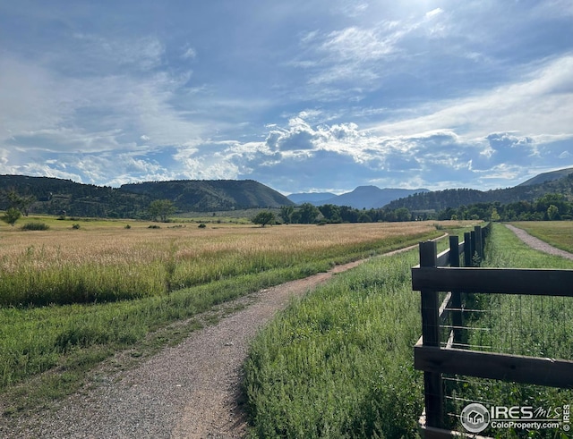 mountain view featuring a rural view