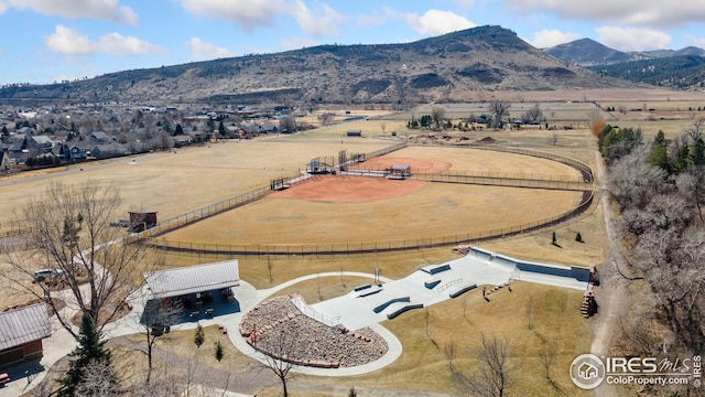 birds eye view of property featuring a mountain view and a rural view