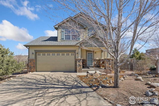 craftsman house featuring driveway, stone siding, fence, roof with shingles, and a garage