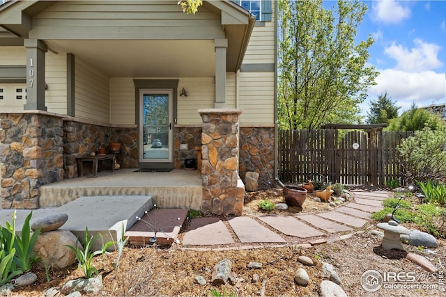 107 Bohn Ct, Lyons, CO 80540 - property entrance featuring stone siding and fence
