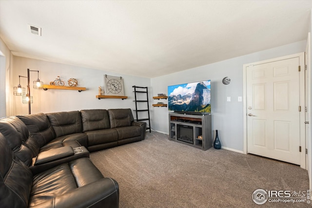 living room featuring visible vents, baseboards, and carpet