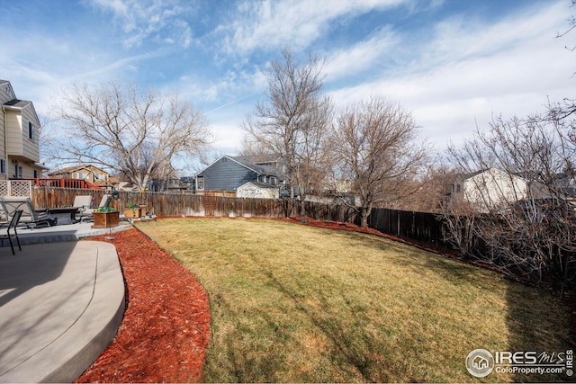 view of yard featuring a patio and a fenced backyard