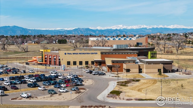 birds eye view of property with a mountain view