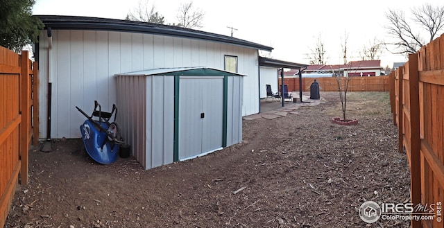 view of shed with a fenced backyard