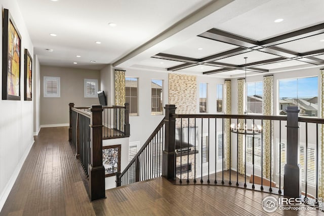 hall featuring baseboards, an upstairs landing, recessed lighting, wood finished floors, and coffered ceiling