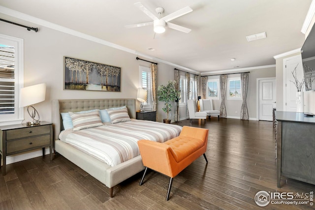 bedroom with dark wood-style floors, visible vents, baseboards, and ornamental molding