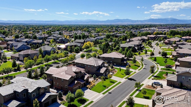 birds eye view of property featuring a mountain view and a residential view