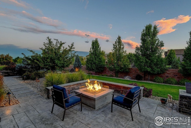 view of patio featuring an outdoor fire pit