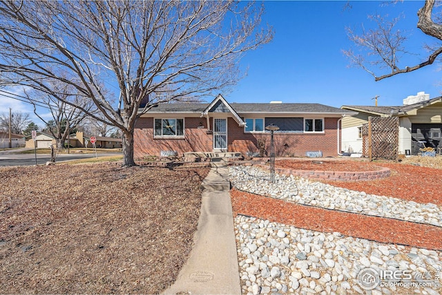 single story home with brick siding