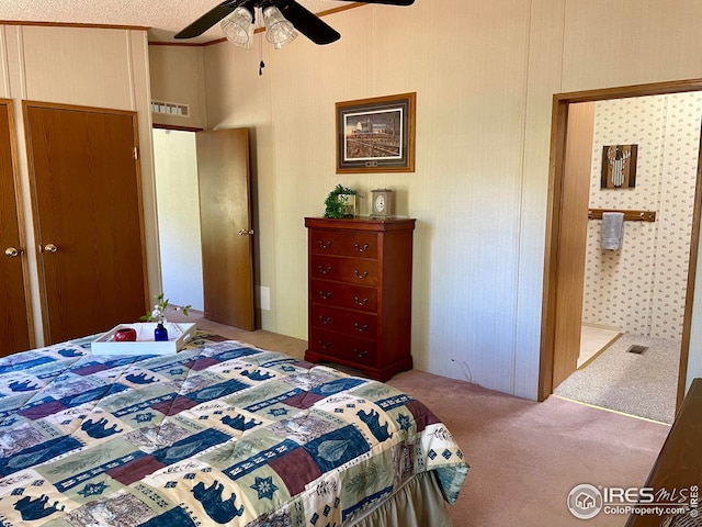 carpeted bedroom featuring visible vents and a ceiling fan