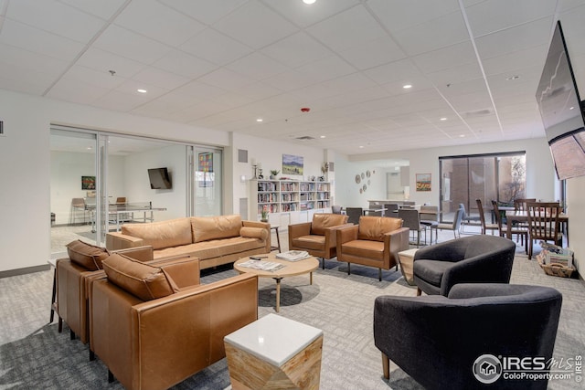 carpeted living room featuring recessed lighting, baseboards, a paneled ceiling, and visible vents