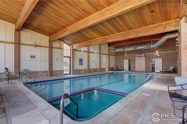 view of pool with a pool with connected hot tub