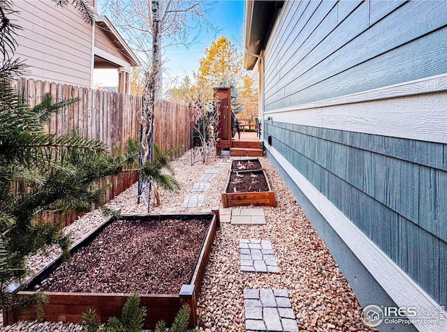 view of yard featuring a garden and fence