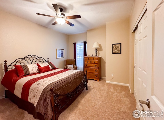 bedroom with light carpet, ceiling fan, and baseboards