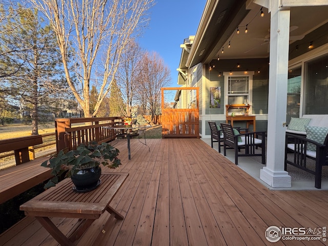 wooden terrace featuring outdoor dining space