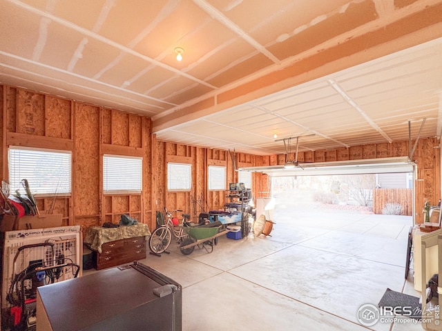 garage featuring wood walls