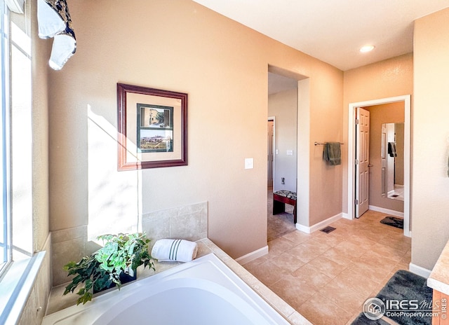 full bathroom with a bath, visible vents, tile patterned floors, and baseboards