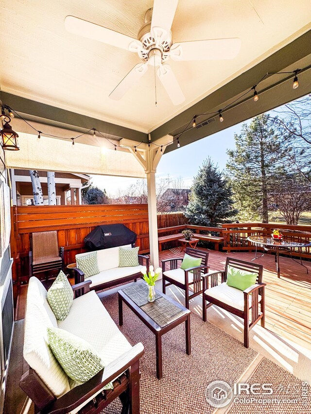 view of patio with a deck, outdoor lounge area, a ceiling fan, and fence