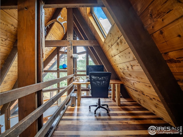 unfurnished office featuring wood ceiling, hardwood / wood-style floors, vaulted ceiling with beams, and wood walls
