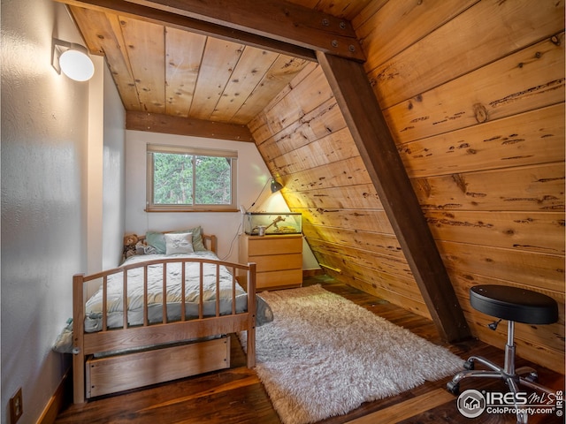 bedroom with wood ceiling, wood finished floors, and vaulted ceiling