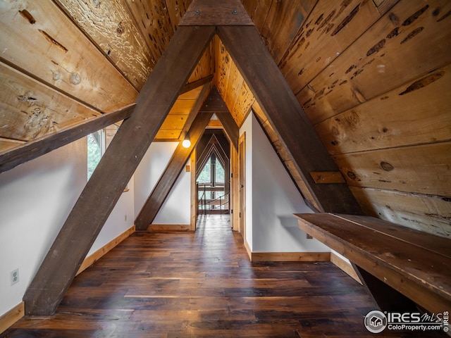 additional living space with vaulted ceiling, wood ceiling, baseboards, and wood-type flooring