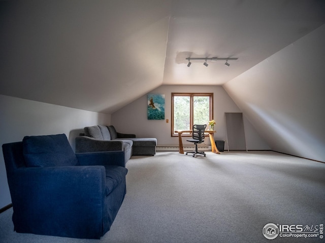 living area with baseboard heating, carpet flooring, rail lighting, and lofted ceiling