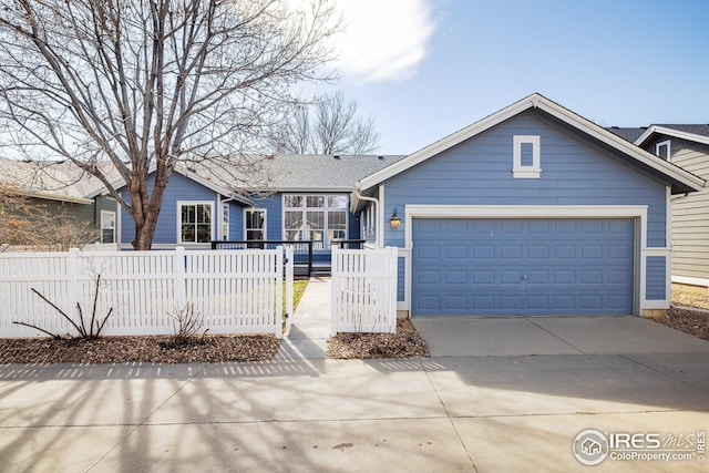 ranch-style house with a fenced front yard, a garage, and driveway