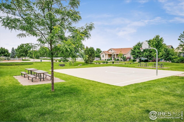view of basketball court with a yard and community basketball court
