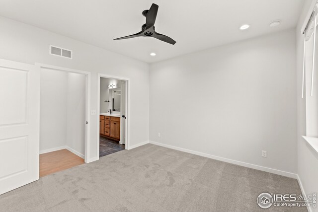 unfurnished bedroom with recessed lighting, visible vents, baseboards, and carpet