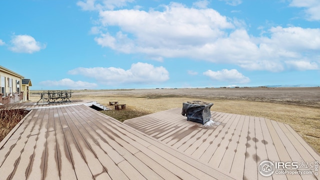 wooden deck featuring outdoor dining space