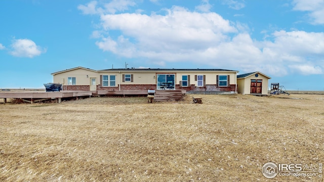 manufactured / mobile home with brick siding and roof mounted solar panels