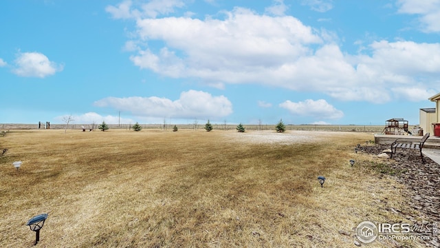 view of yard with a rural view
