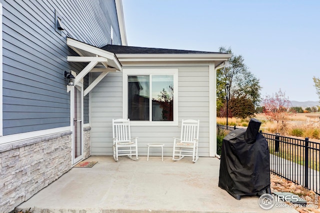 view of patio / terrace with grilling area and fence