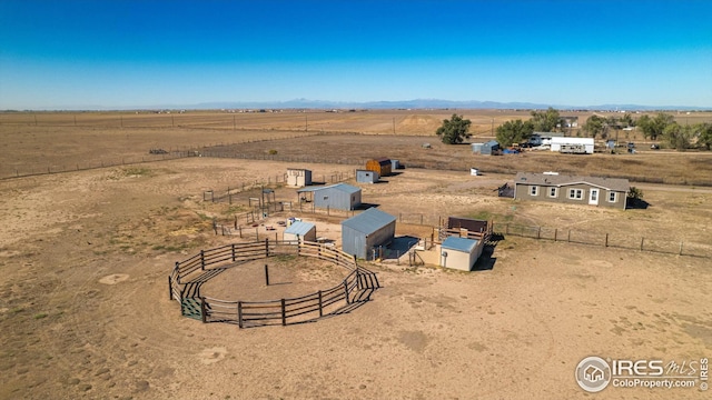birds eye view of property with a rural view and view of desert