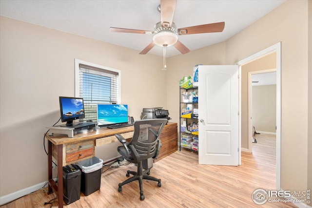 office featuring light wood-type flooring, baseboards, and ceiling fan