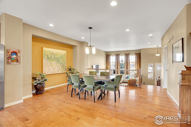 dining space with recessed lighting, baseboards, and light wood finished floors