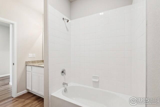 952 Cascade Falls St, Severance, CO 80550 - bathroom with wood finished floors,  shower combination, and vanity