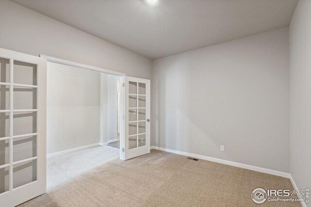 952 Cascade Falls St, Severance, CO 80550 - unfurnished bedroom featuring french doors and carpet flooring