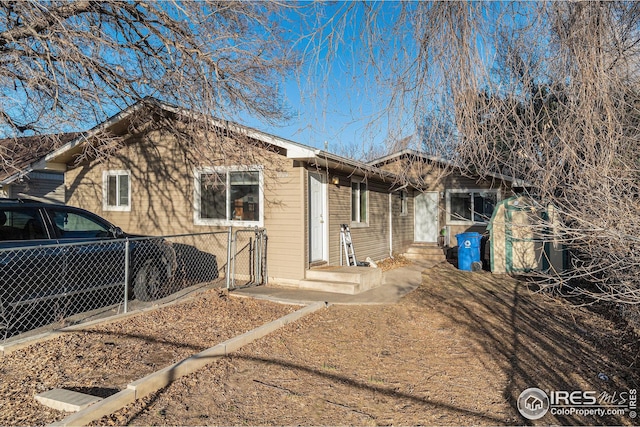 1322 Washington Ave, Loveland, CO 80537 - view of front of home with fence