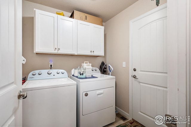 4216 Yellowbells Dr, Evans, CO 80620 - washroom featuring cabinet space and independent washer and dryer