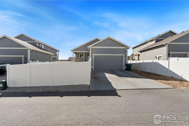 4216 Yellowbells Dr, Evans, CO 80620 - garage featuring driveway and fence